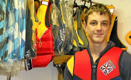 Jack Cavanagh tries on a life jacket to make sure it is a snug fit. Jack Cavanagh tries on a life jacket to make sure it is a snug fit.